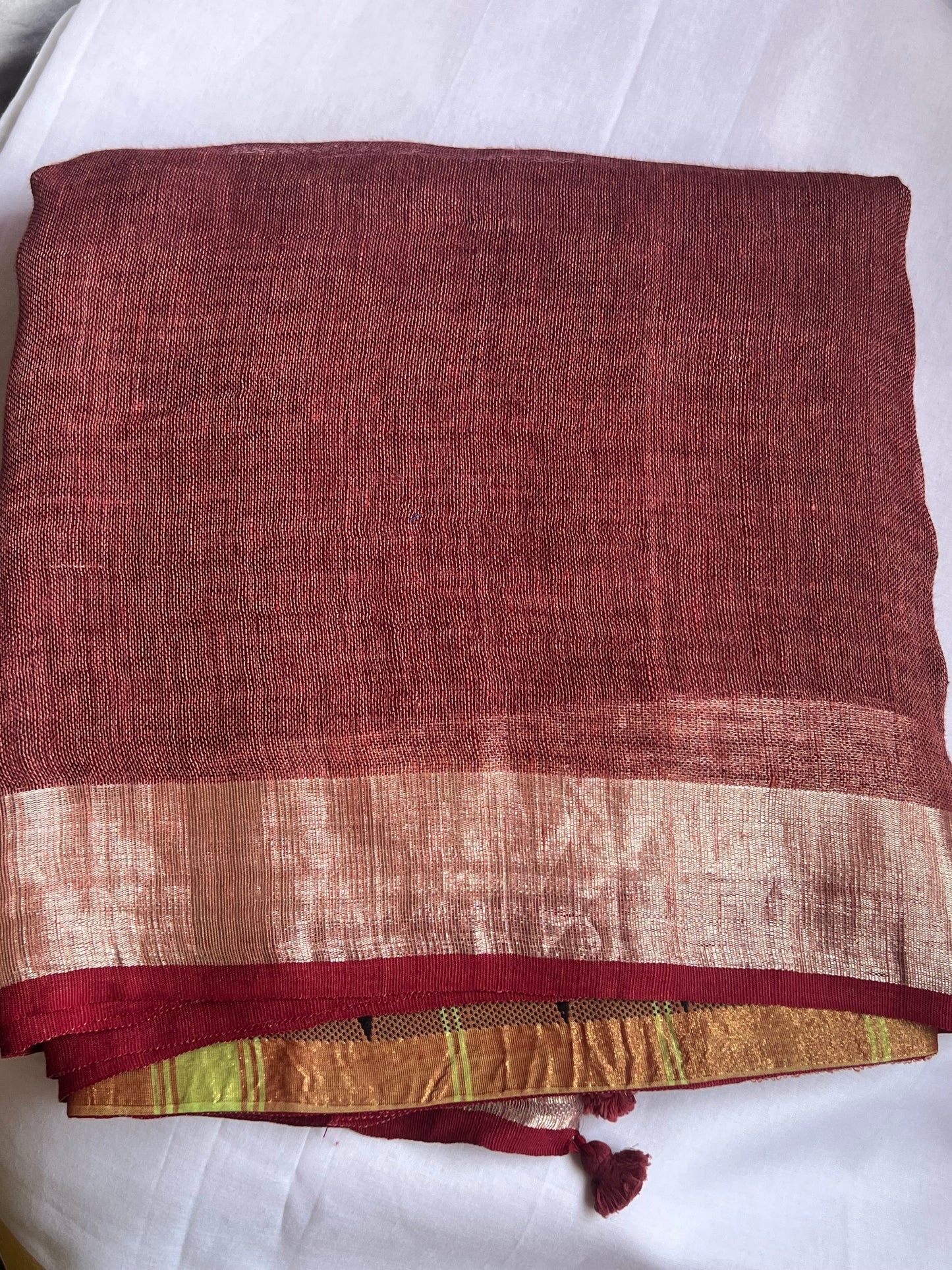 Brick red and green linen cotton saree