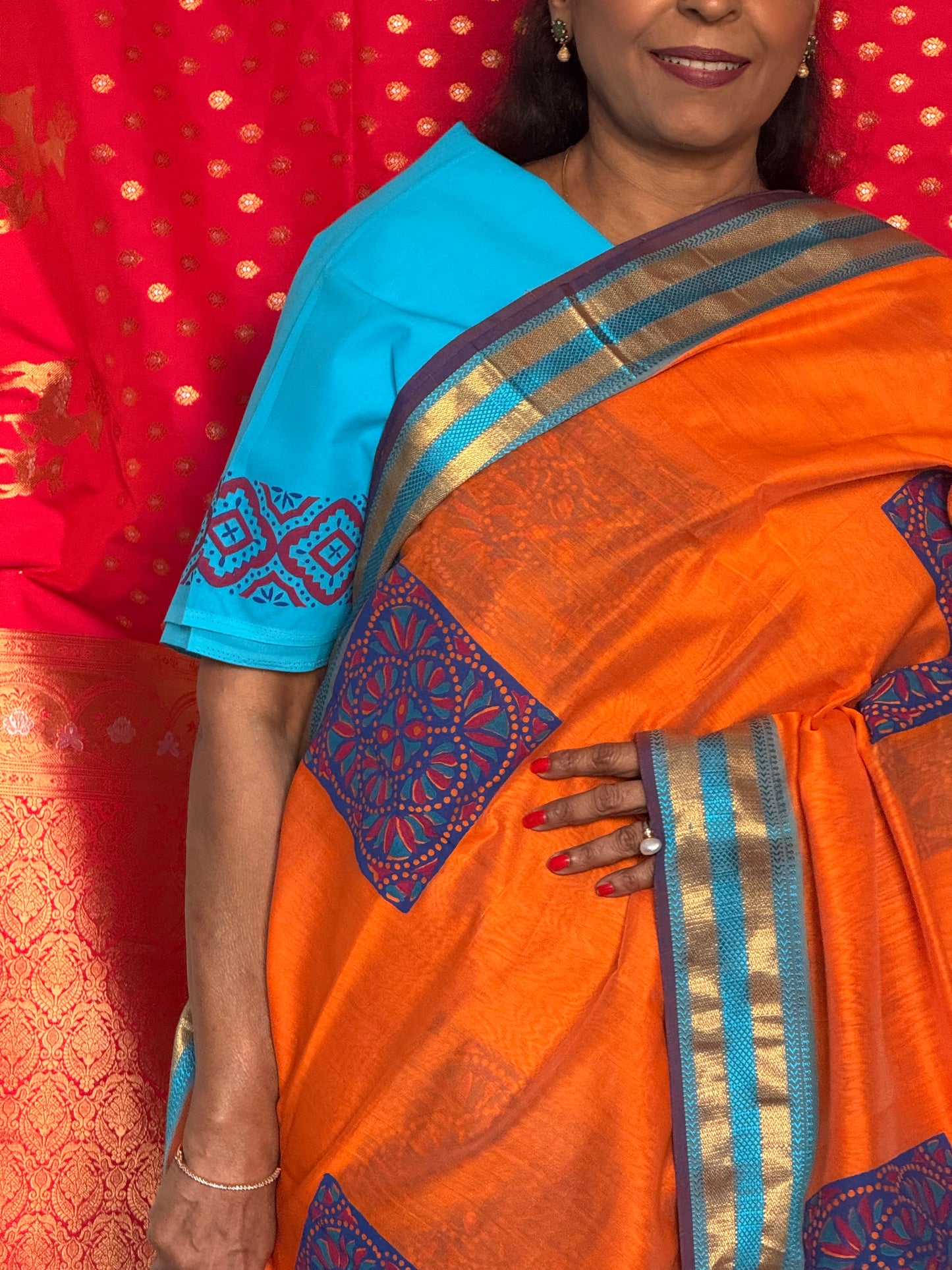 Orange silk cotton saree with block print