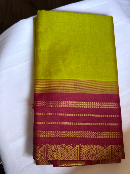 Yellow silk cotton saree with red pallu & border