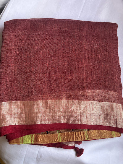 Brick red and green linen cotton saree