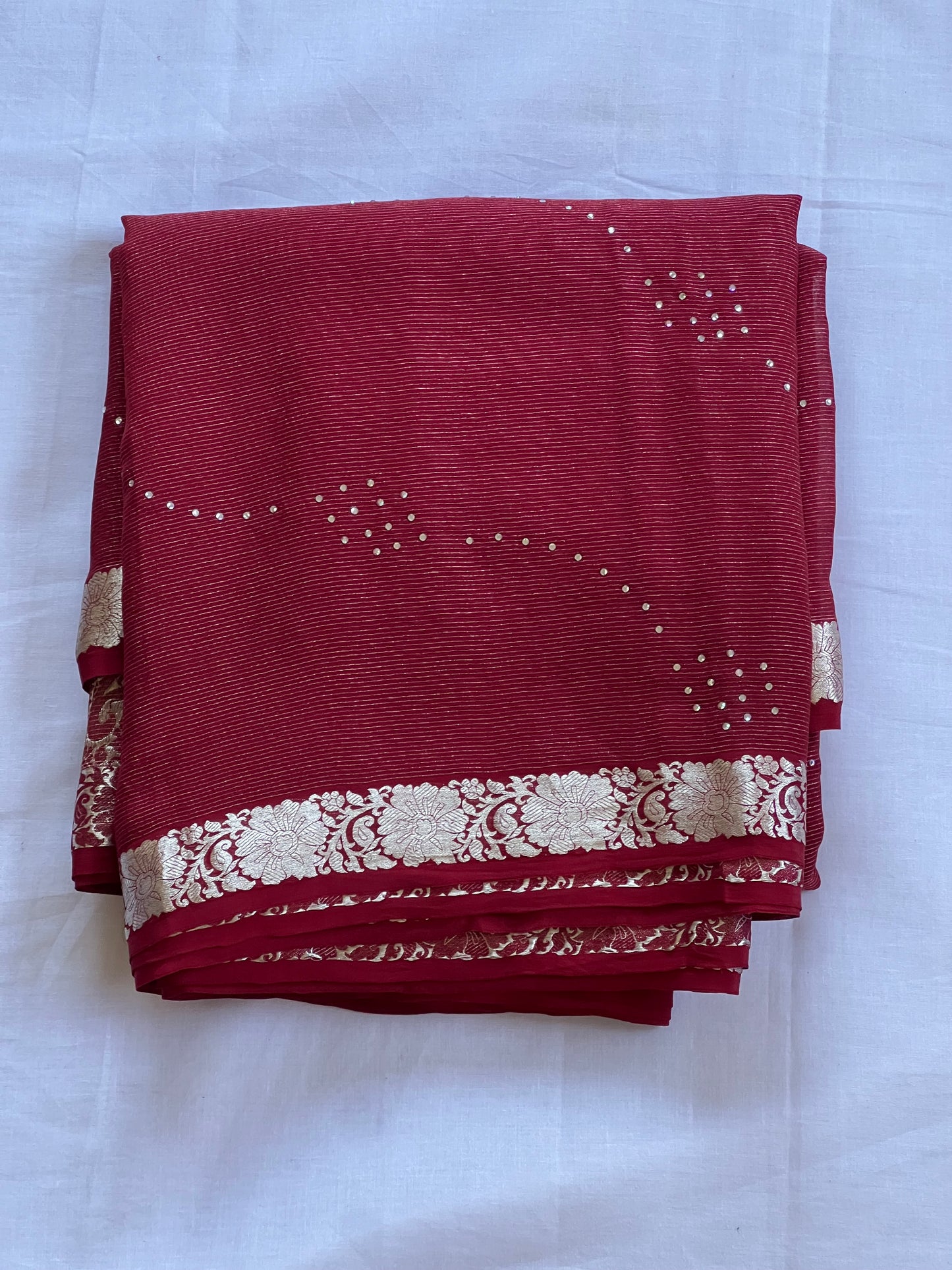 Maroon pure crepe saree with white stone