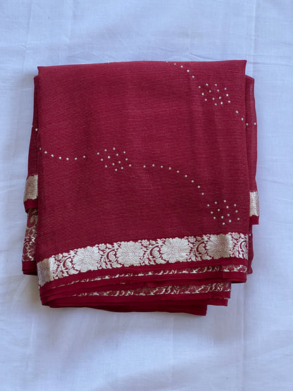 Maroon pure crepe saree with white stone