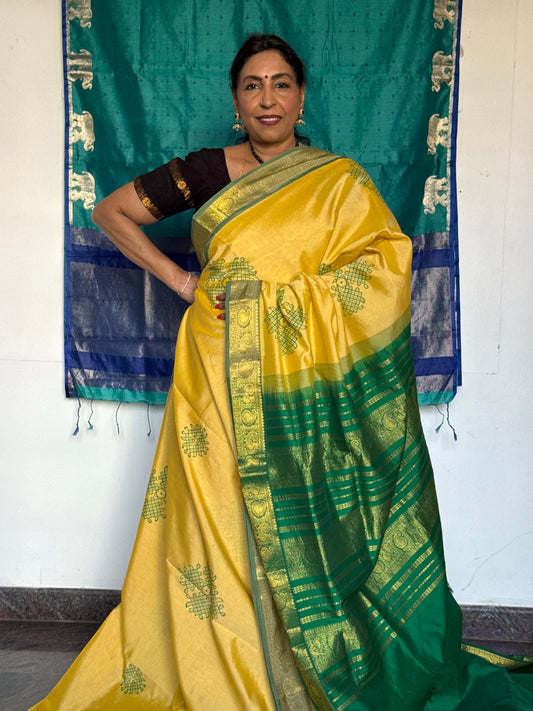 Yellow semi silk cotton saree with kolam print