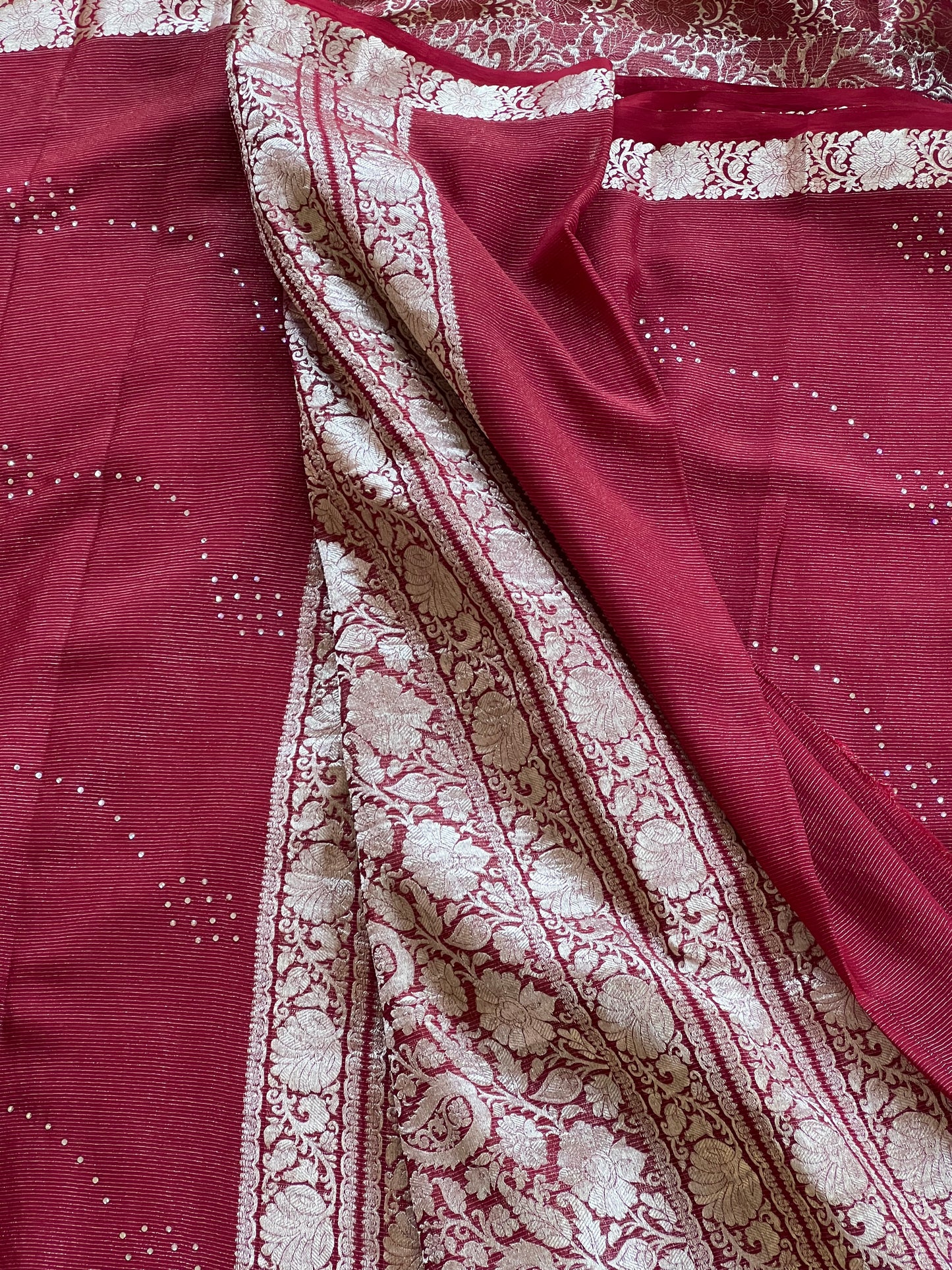 Maroon pure crepe saree with white stone