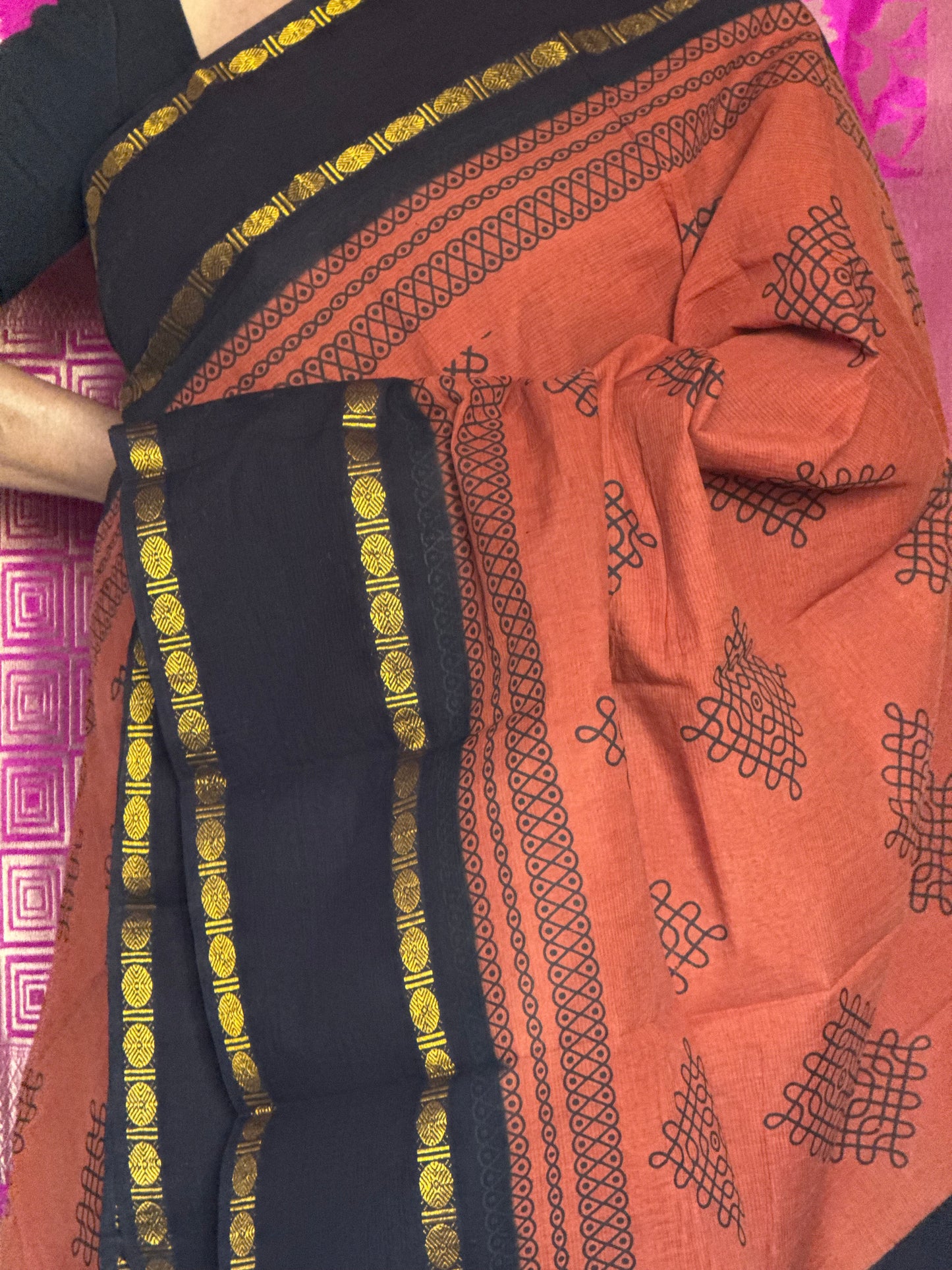 Orange and black sungudi saree