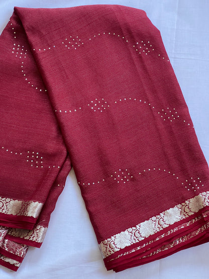 Maroon pure crepe saree with white stone