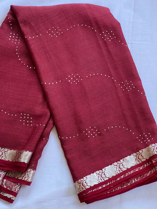 Maroon pure crepe saree with white stone