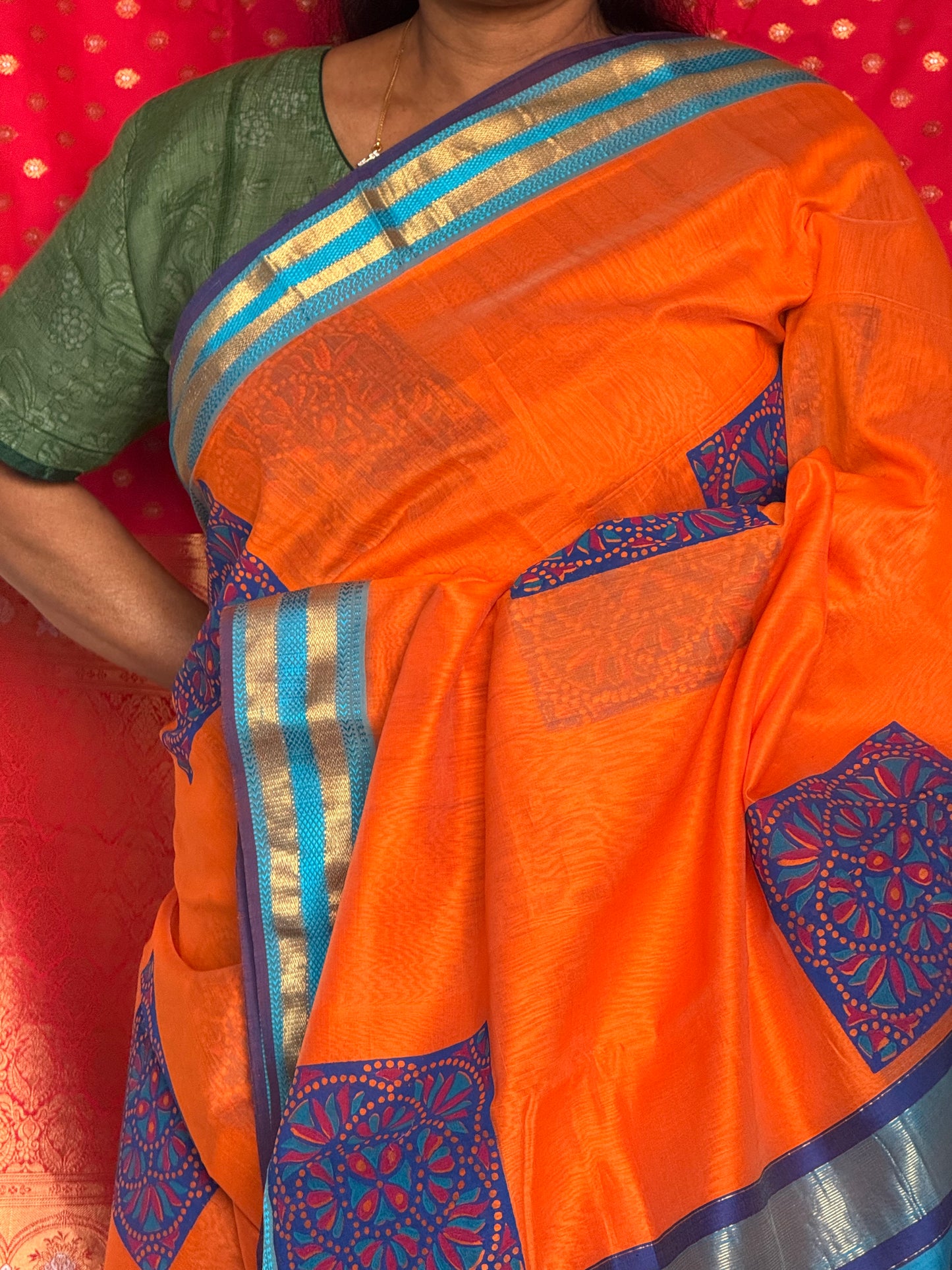 Orange silk cotton saree with block print