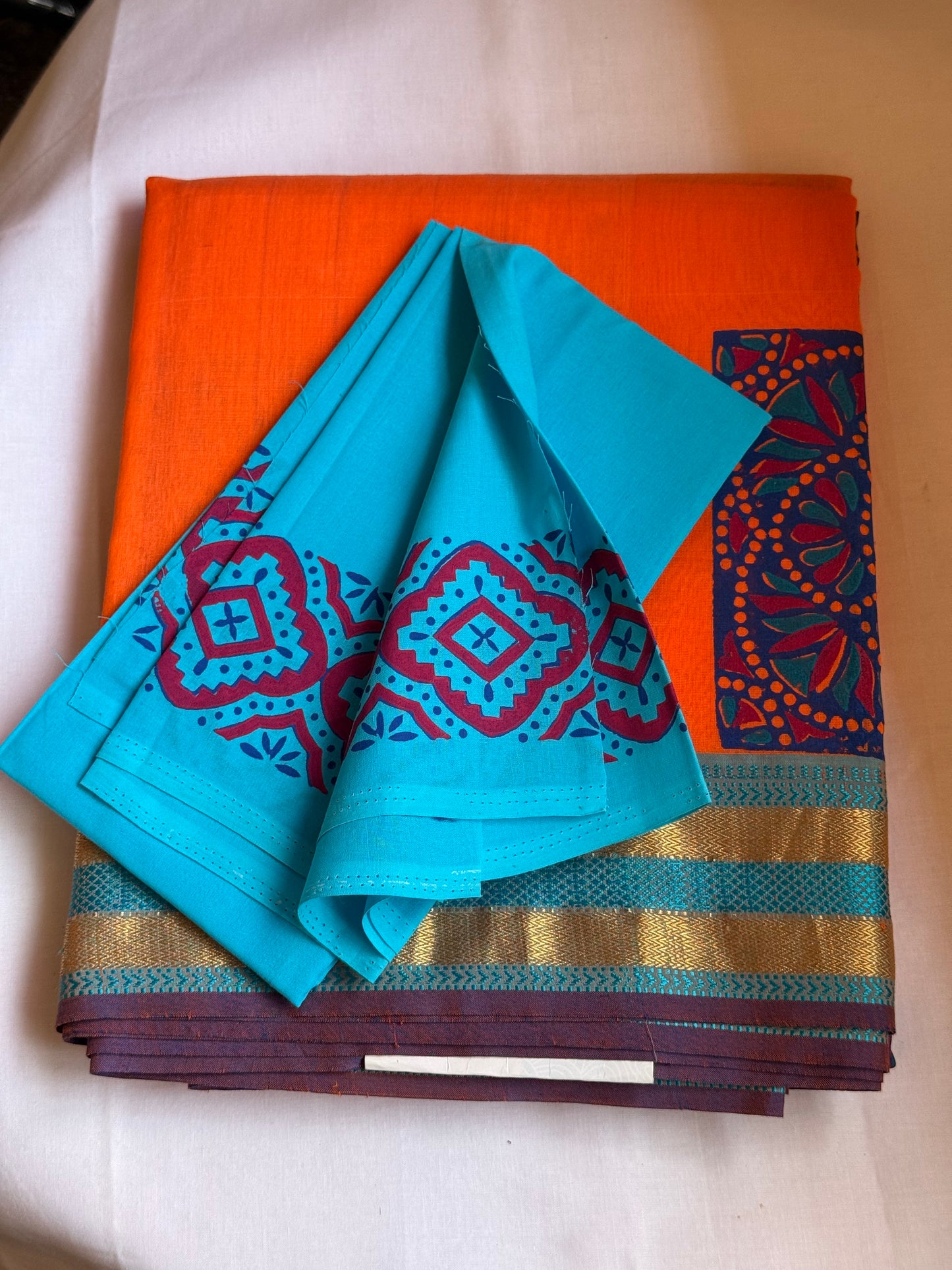 Orange silk cotton saree with block print