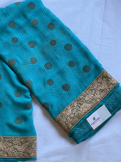 Blue georgette saree with jute border