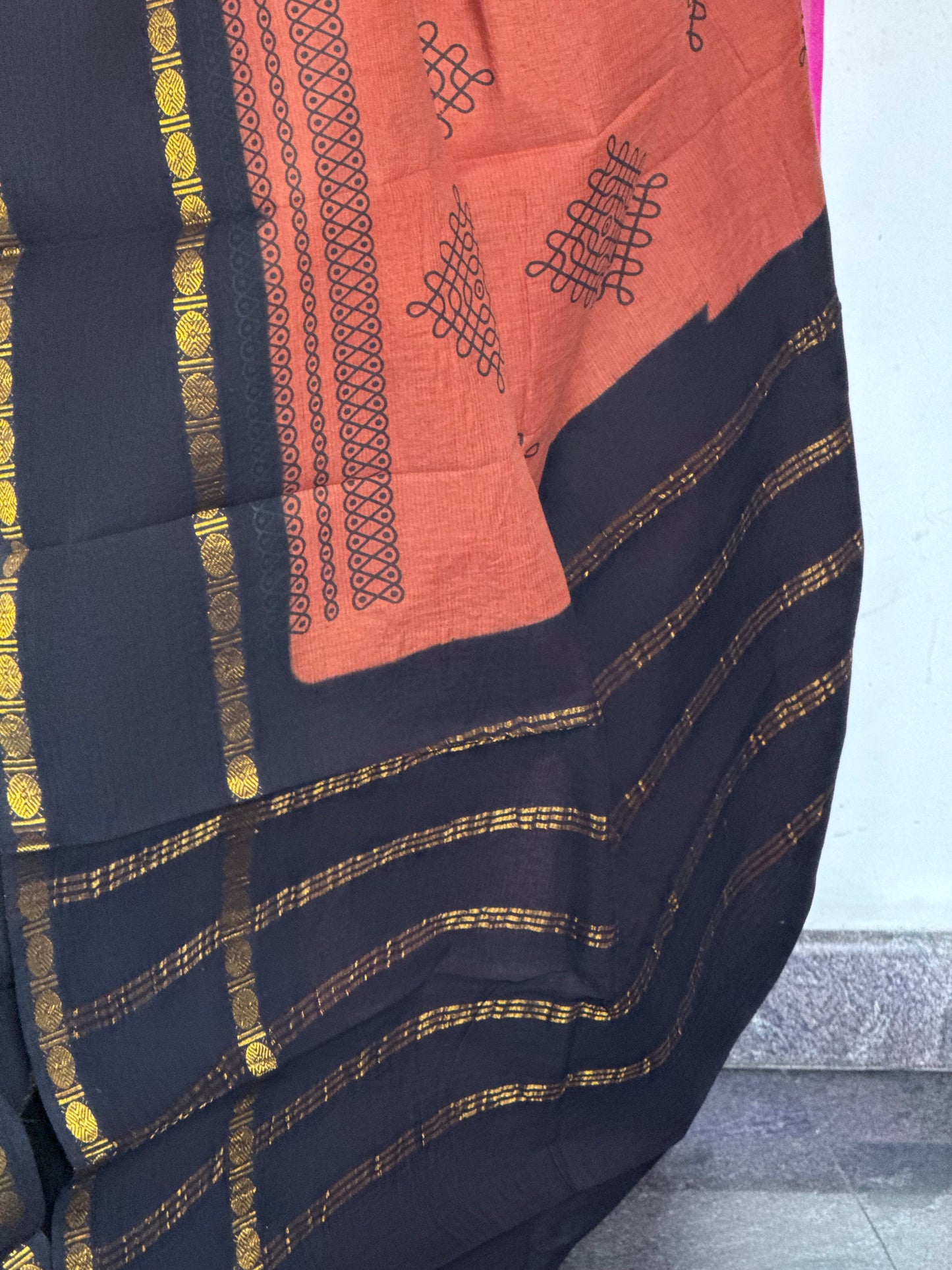 Orange and black sungudi saree